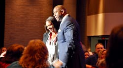 Basketball star and businessman Earvin &apos;Magic&apos; Johnson engages with Rental Show attendees.