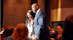 Basketball star and businessman Earvin &apos;Magic&apos; Johnson engages with Rental Show attendees.