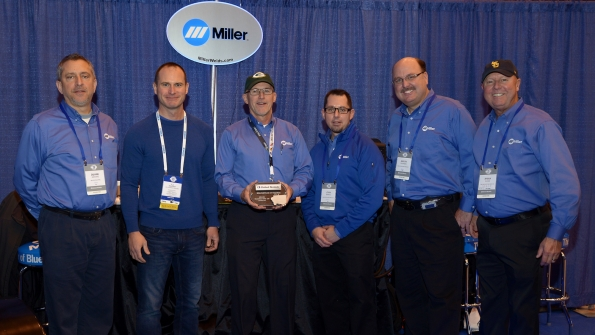 Miller Electric staff dressed in the company39s familiar blue receive the 2016 Supplier of the Year Award from United Rentals From left Duane Dipietro TJ Mahoney of United Rentals Jeff Moureau John Swartz Aaron Peterson and Brian Davies