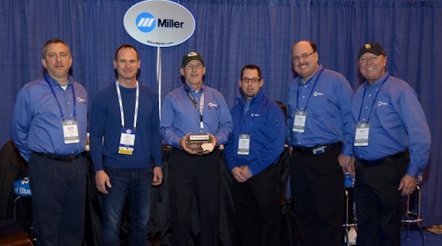 Miller Electric staff, dressed in the company&apos;s familiar blue, receive the 2016 Supplier of the Year Award from United Rentals. From left: Duane Dipietro, T.J. Mahoney of United Rentals, Jeff Moureau, John Swartz, Aaron Peterson and Brian Davies.