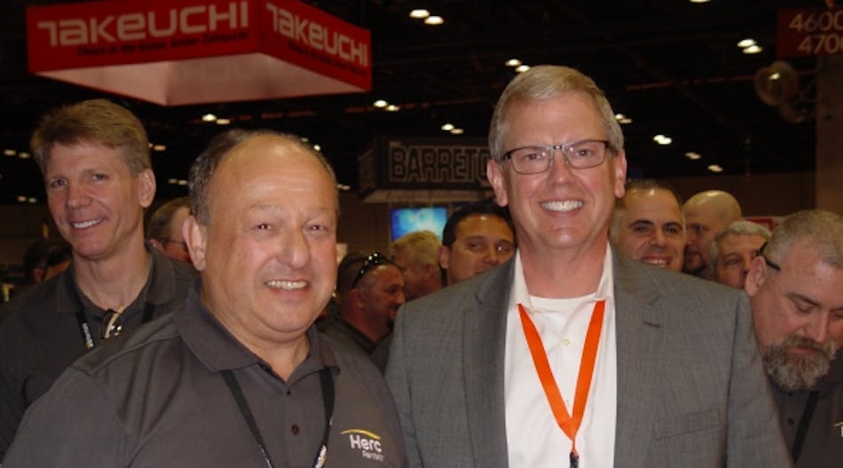 Herc Rentals CEO Larry Silber with JLG president Frank Nerenhausen at JLG&apos;s booth at the Rental Show in Orlando, Fla., this week.