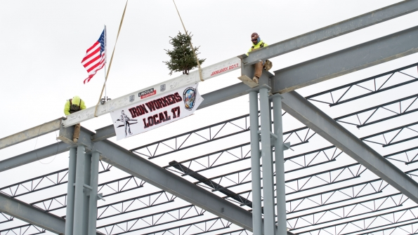 Crews place the final beam in the structure of Lincoln Electric Co39s Welding Technology Center