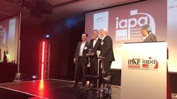 Wade Carson left and Jim Colvin right accept the award from Brad Boehler President of Skyjack At right is BBC sports broadcaster John Inverdale Wade Carson left and Jim Colvin right accept the award from Brad Boehler President of Skyjack At right is BBC sports broadcaster John Inverdale