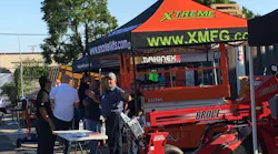 Jim Grasse of Broce Brooms talks about equipment with a rental company visitor Broce Snorkel Makinex and others exhibited at the ARACRA chapter meeting at American Pneumatic Tools39 facility in Santa Ana