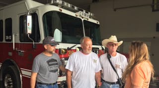 Gary Morgart, JLG Bedford director of operations and Emily Hadley, Access HR, discuss team assignments with Gerald Leppert, Alum Bank/Pleasantville Volunteer Fire Co. president and Jim Dull for the Fire Co.&apos;s 30th annual car show, which raises the bulk of funds needed to operate the Fire Co.