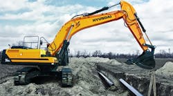 A Hyundai HX380L excavator at work laying pipes. A Hyundai HX380L excavator at work laying pipes.