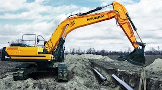 A Hyundai HX380L excavator at work laying pipes.