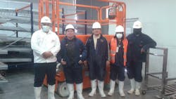 Workers at the Avicola Sofia plant in La Paz Bolivia with their new Snorkel S3219E scissorlift inside a refrigerated storage unit Workers at the Avicola Sofia plant in La Paz Bolivia with their new Snorkel S3219E scissorlift inside a refrigerated storage unit