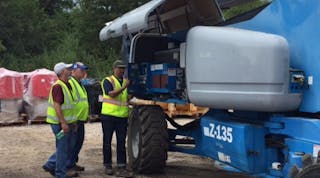 Terex AWP product support staff checking out a Genie boomlift at United Rentals&apos; Beaumont, Texas, branch.