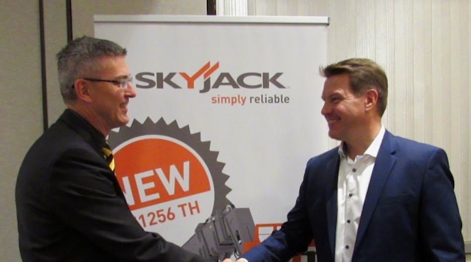 Skyjack president Brad Boehler, left, announces new telematics partnership with Trackunit chief operating officer Tom Valbak Aardestrup.