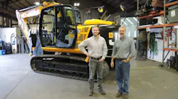 From left Norlift JCB sales manager Nate Jarvis and owner Jay Jarvis with the first sold JCB machine a JS145 excavator