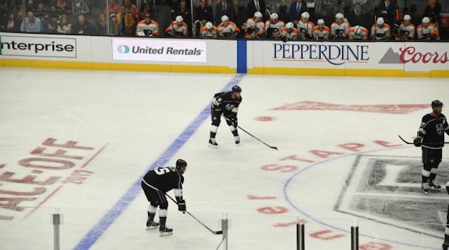 United Rentals&apos; ad is visible by the visitors bench at AEG&apos;s Staples Center in Los Angeles as the L.A. Kings prepare to face off against the Philadelphia Flyers in a recent game.