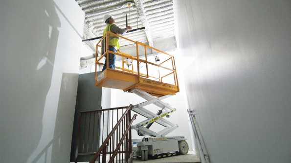 A Custom 1230 scissorlift can be put to use in narrow places