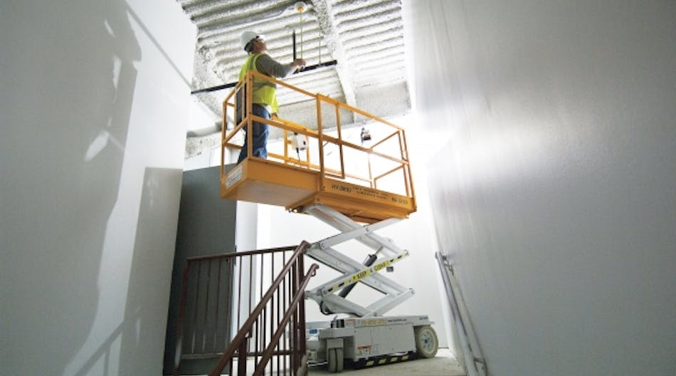 A Custom 1230 scissorlift can be put to use in narrow places.