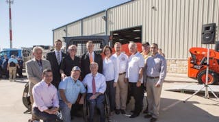 Kubota governor Greg Abbott, seated in center, thanks Kubota staff for the contribution, which included money and skid-steer loaders.