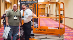 Snorkel majority owner Don Ahern right presents a Snorkel S3010P to Kevin Davis of American Rentals Long Beach Calif