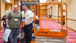 Snorkel majority owner Don Ahern right presents a Snorkel S3010P to Kevin Davis of American Rentals Long Beach Calif