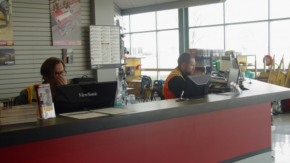 Staff at Battlefield Equipment Rental39s rental counter in Brantford Ontario Canada