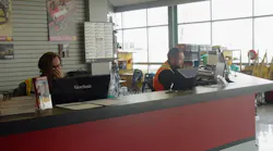 Staff at Battlefield Equipment Rental39s rental counter in Brantford Ontario Canada