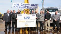 Komatsu CARE service team at J. Fletcher Creamer &amp; Sons in honor of 100,000 service intervals completed.