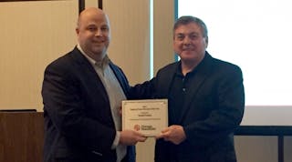 Jonathan Cook, vice president of sales at Chicago Pneumatic (left), presents Regional Sales Manager of the Year award to Dmitri Cremo, Melcroft, Pa., for having the highest volume of sales on the CP team.