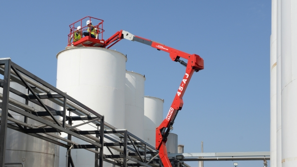 A MEC boomlift at work at an industrial site