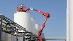 A MEC boomlift at work at an industrial site A MEC boomlift at work at an industrial site