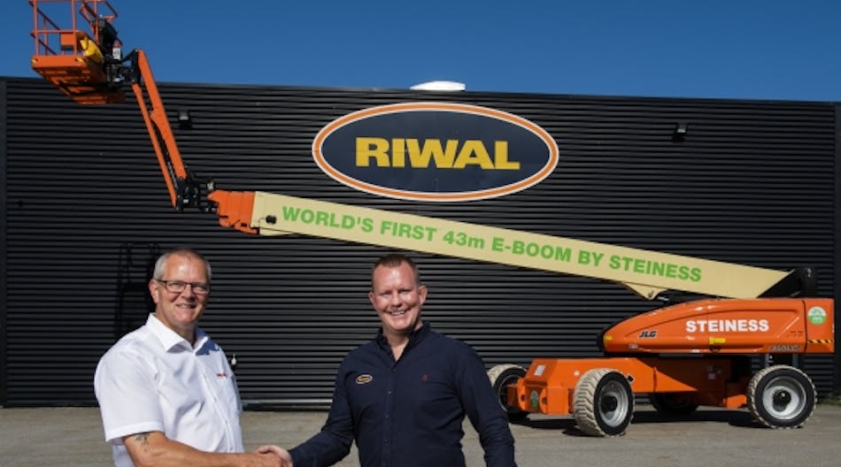 Poul Steiness, left, receiving his brand new 100-percent electric boomlift, handed over by Riwal equipment sales manager Nordics, Jesper Becker.