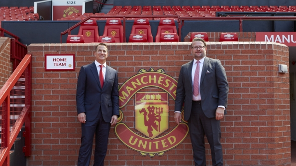 David Kohler president and CEO of Kohler Co left with Richard Arnold group managing director of Manchester United with the Manchester United logo
