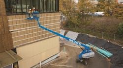 A Genie S65 XC telescopic boomlift at work A Genie S65 XC telescopic boomlift at work