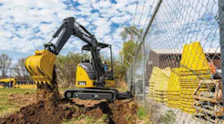 A John Deere compact excavator at work