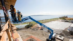 A Genie S85 XC boomlift at work A Genie S85 XC boomlift at work