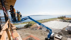 A Genie S85 XC boomlift at work A Genie S85 XC boomlift at work