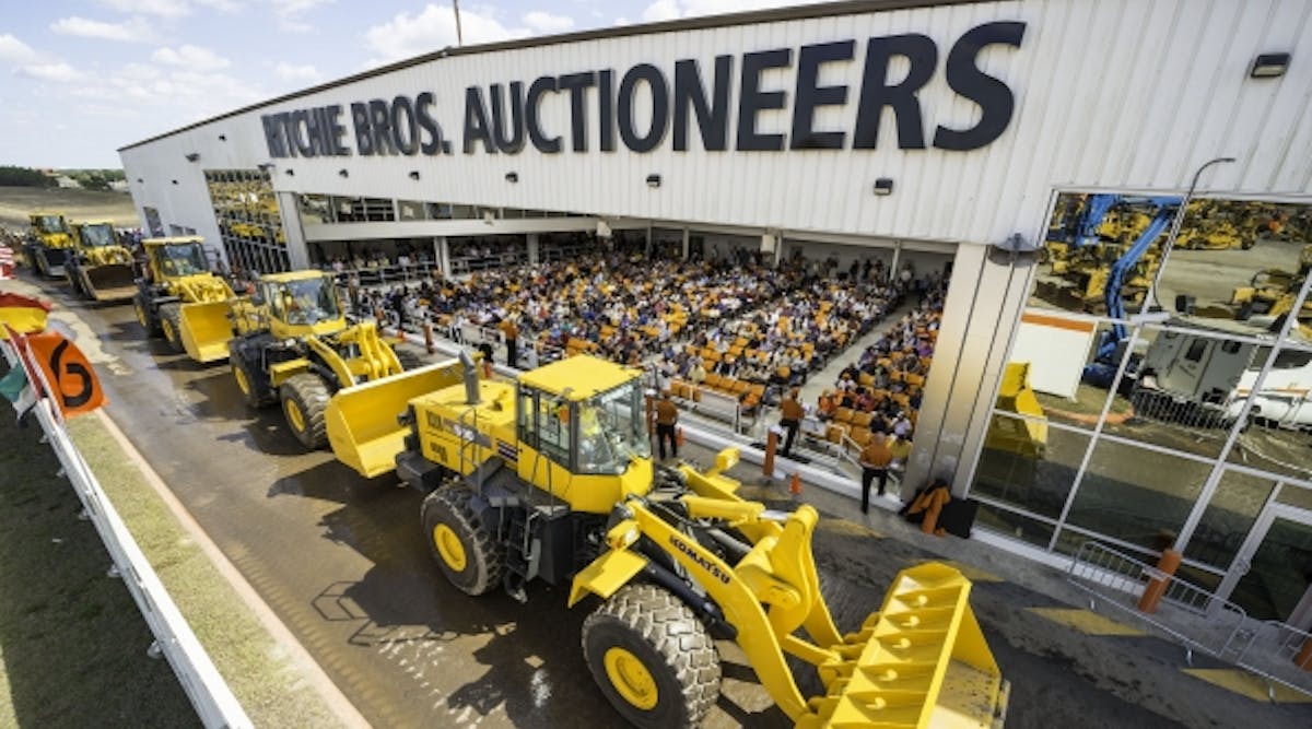 Wheel loaders at a Ritchie Bros. auction in Orlando, Fla. Ritchie now introduces an online asset management system with data analytics, dashboards, e-commerce sites and external sales channels.
