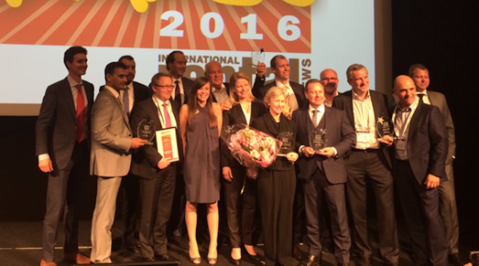 Turner, sixth from right, accepts European Rental Association rental company of the year award in 2016.