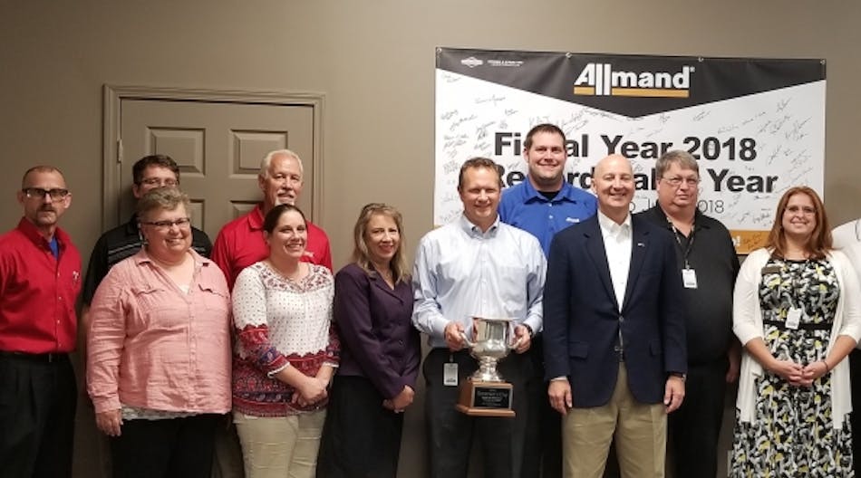 Governor Pete Ricketss (in blue blazer) visits Allmand Bros. to celebrate the anniversary. In the back row are Allmand Bros. employees Paul Sabatka, Cole Booth, Gary Hastings, Wayne Kulhanek and Larry Cox. In the front row, Jennifer Swift, Shannon Hinrichs, Leah Sarconi, Jeremy Alby, Governor Ricketts and Karen Aldama.