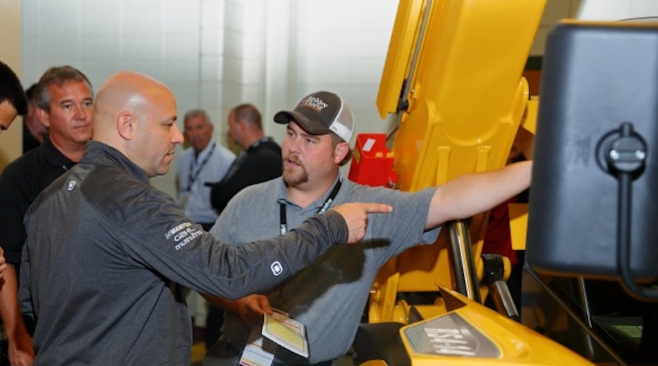 A Manitou product expert shares information at the dealer meeting.