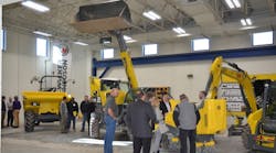 Visitors attending the signing of the apprenticeship program receive a guided tour of the extensive training facilities.