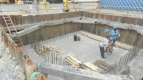 Workers in a trench protected by NTS shoring equipment