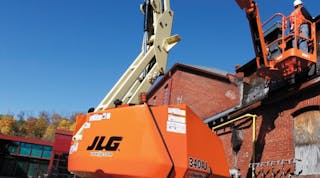 A worker using a JLG 340 AJ aerial work platform on a jobsite somewhere in the United States.