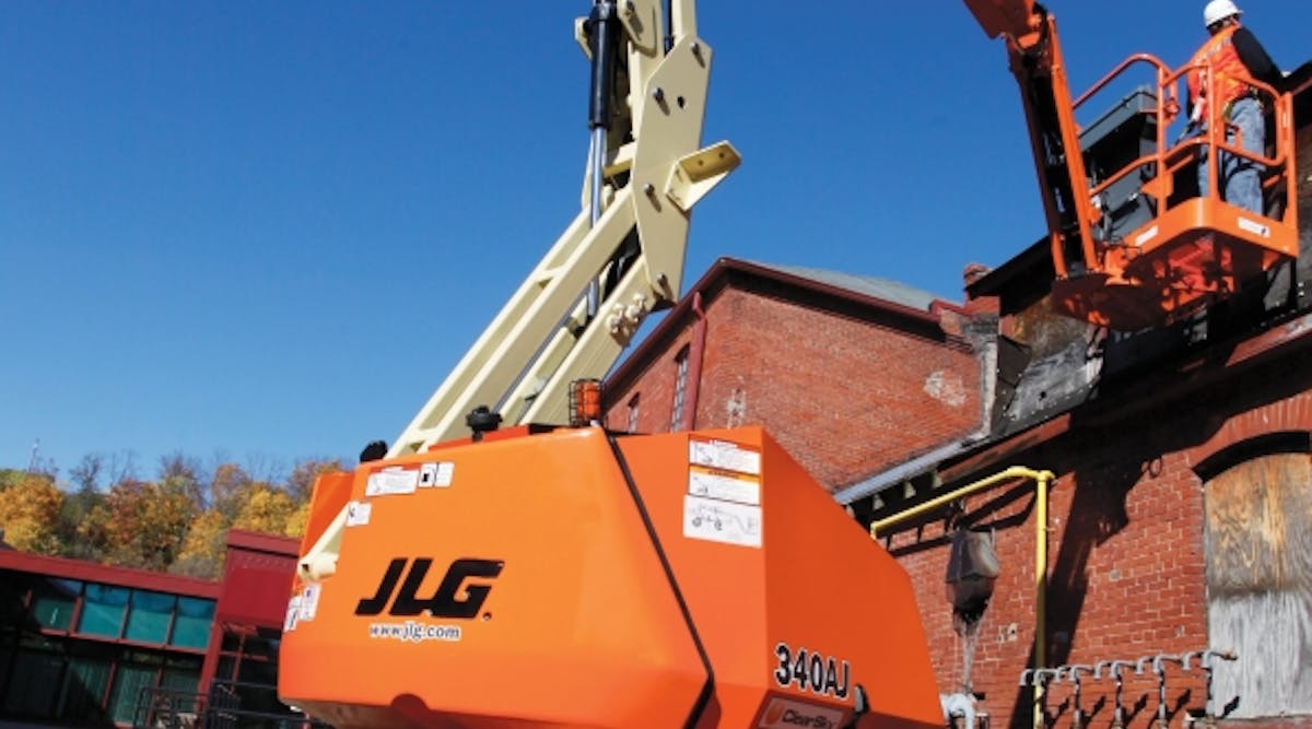 A worker using a JLG 340 AJ aerial work platform on a jobsite somewhere in the United States.