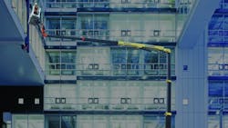 JLG39s X1000 AJ compact crawler boom at work in an office building JLG39s X1000 AJ compact crawler boom at work in an office building