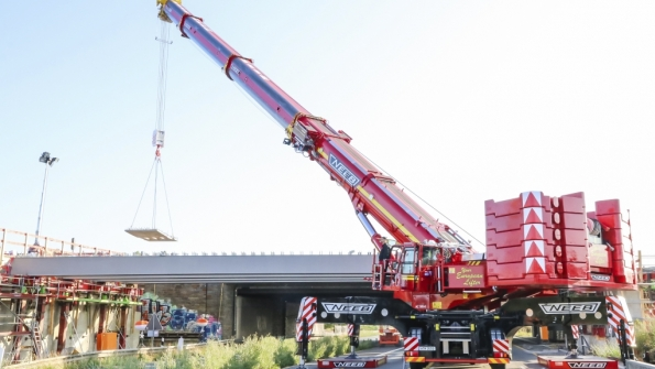 A Demag AC 5008 allterrain crane works on the expansion of a bridge crossing over the A1 freeway near Cologne Germany