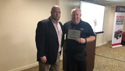 Vice president of sales Jonathan Cook left presents award for pump sales to Paul McClendon Vice president of sales Jonathan Cook left presents award for pump sales to Paul McClendon