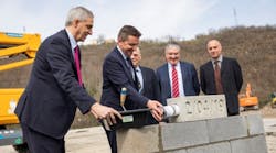 From left, Alexandre Saubot, Haulotte CEO; Ga&euml;l Perdriau, President of Saint-Etienne M&eacute;tropole and Mayor of Saint-Etienne; G&eacute;rard Tardy, mayor of the municipality of Lorette; Patrice M&eacute;tairie, COO industry of Haulotte; and Thierry Milhaud, architect, laying the foundation for Haulotte&rsquo;s new headquarters in France.
