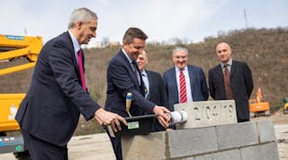From left, Alexandre Saubot, Haulotte CEO; Ga&euml;l Perdriau, President of Saint-Etienne M&eacute;tropole and Mayor of Saint-Etienne; G&eacute;rard Tardy, mayor of the municipality of Lorette; Patrice M&eacute;tairie, COO industry of Haulotte; and Thierry Milhaud, architect, laying the foundation for Haulotte&rsquo;s new headquarters in France.