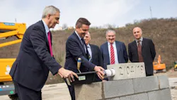 From left Alexandre Saubot Haulotte CEO Gaeumll Perdriau President of SaintEtienne Meacutetropole and Mayor of SaintEtienne Geacuterard Tardy mayor of the municipality of Lorette Patrice Meacutetairie COO industry of Haulotte and Thierry Milhaud architect laying the foundation for Haulottersquos new headquarters in France