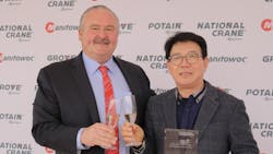 Manitowoc CEO Barry Pennypacker shares a toast with IH Kim president of Shinwoo Development Co a major player in the distribution of Potain Cranes in South Korea Manitowoc CEO Barry Pennypacker shares a toast with IH Kim president of Shinwoo Development Co a major player in the distribution of Potain Cranes in South Korea