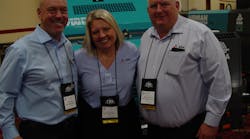 Kevin Day, executive vice president of Alliance North America; Alicia Waineo, vice president of operations; and CEO Mike Niemela on the trade show floor.