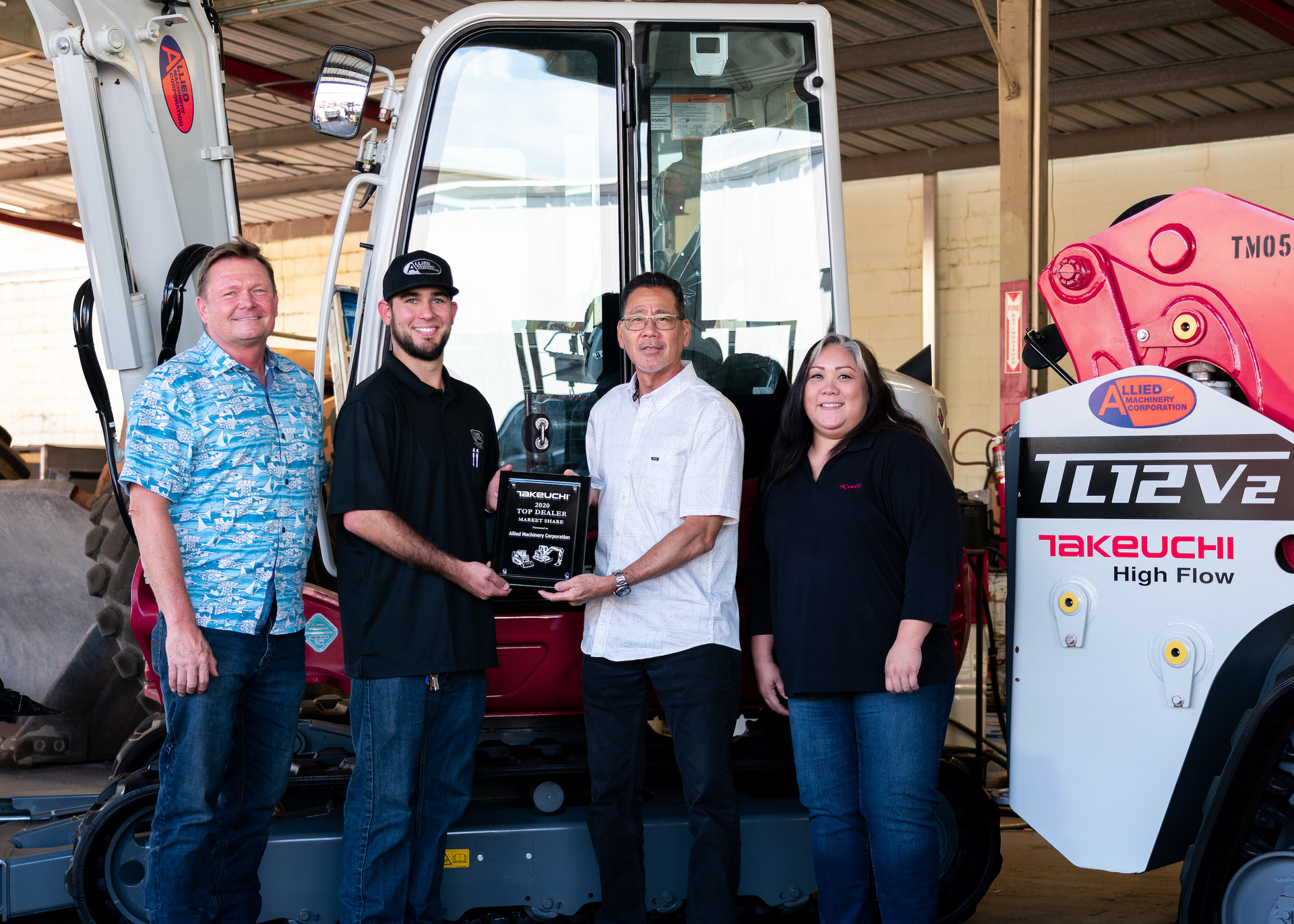 Allied Machinery Corporation displays its dealer award for Top Market Share from Takeuchi. Pictured from left to right: Joe Johnson, Alex Feyerisen, Steve Saito and Noelle Santos.